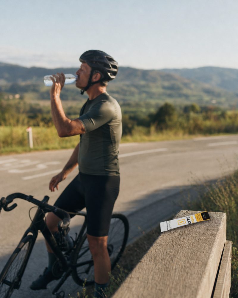 Cyclist at the roadside with a LytePow stick