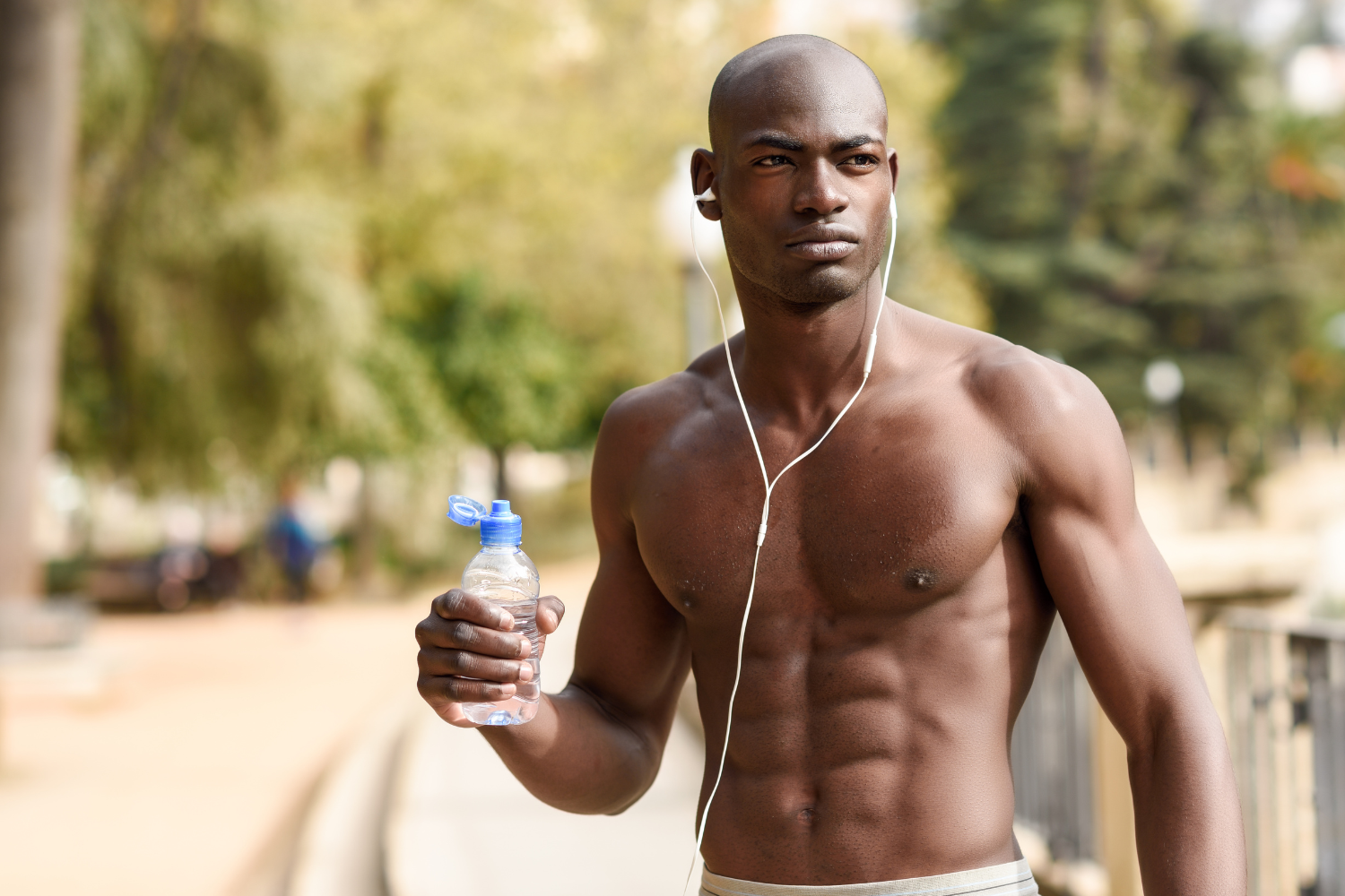 Man holding a clear water bottle
