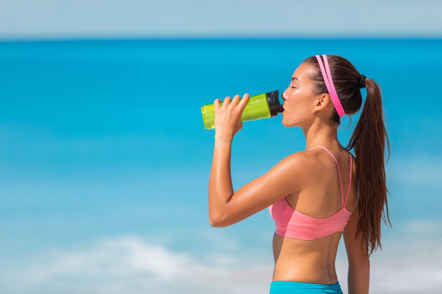 Woman drinking electrolyte drinks.